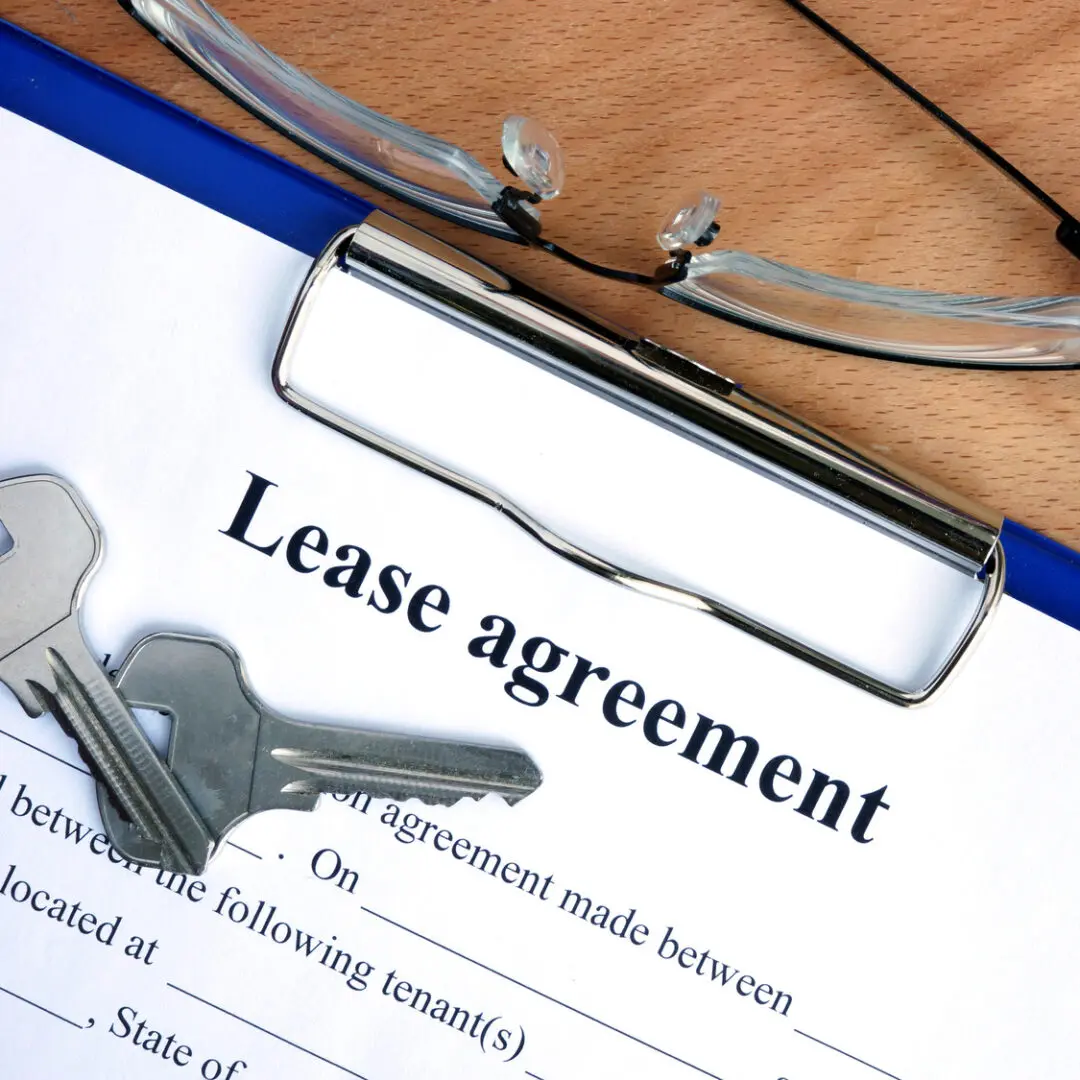 Lease agreement document with house keys
